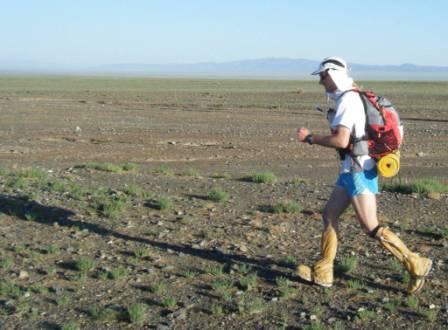 Chris running through the Gobi Desert